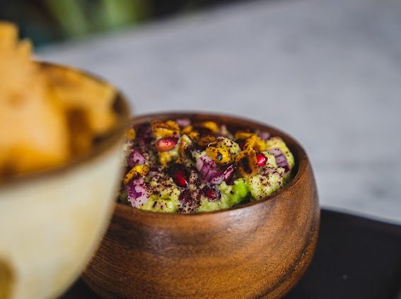 Fresh guacamole for a villa sharing table